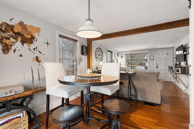 dining space with dark hardwood / wood-style flooring