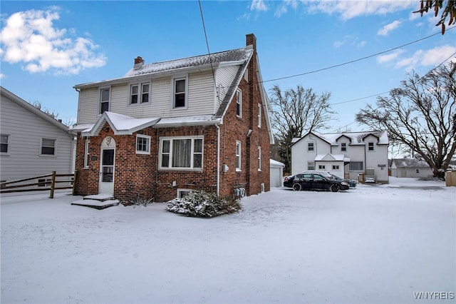 view of snow covered house