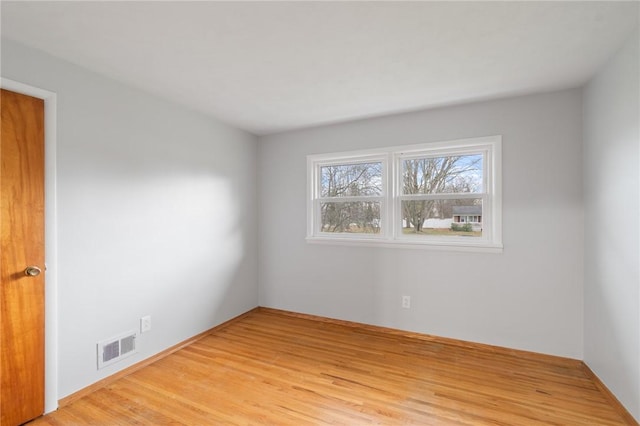 spare room featuring light hardwood / wood-style flooring