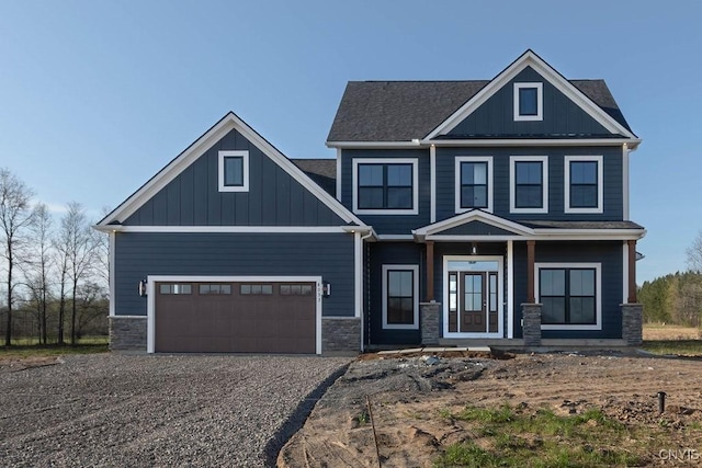 craftsman house featuring covered porch and a garage