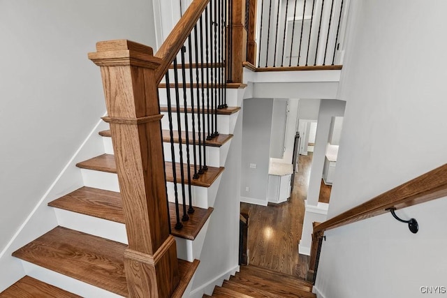 stairway featuring hardwood / wood-style flooring