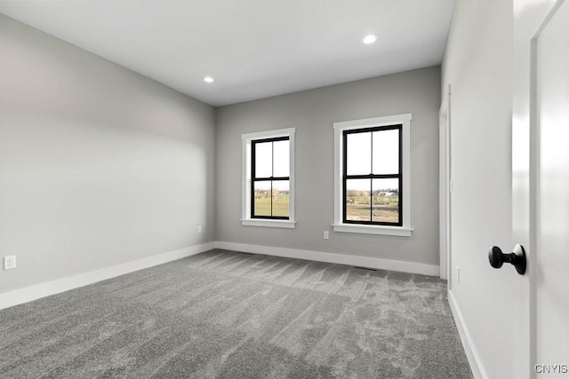 empty room featuring light colored carpet