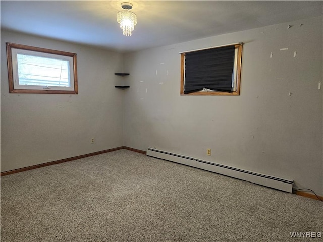 unfurnished room featuring baseboard heating and carpet floors