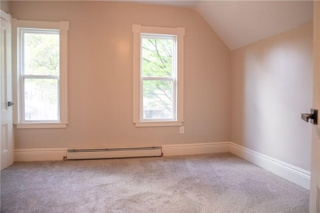 additional living space featuring light carpet, baseboard heating, and vaulted ceiling