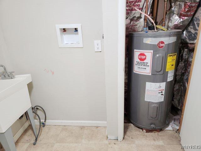 utility room featuring water heater