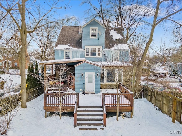 view of snow covered house