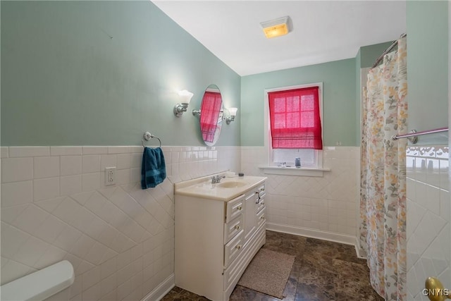 bathroom with tile walls and vanity