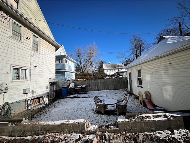 view of yard layered in snow