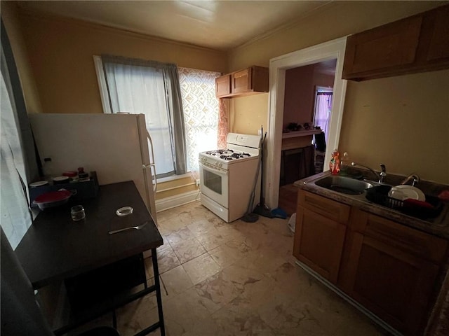 kitchen with sink and white gas range oven