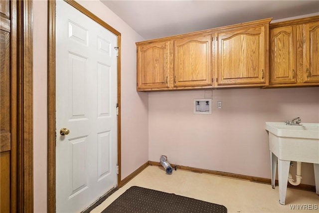 laundry room with cabinets and washer hookup