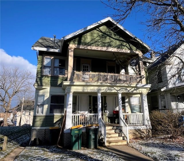 view of front facade featuring a balcony and a porch