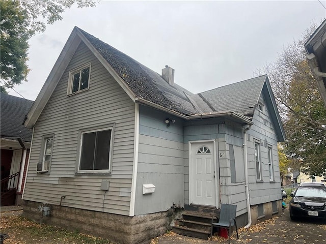 view of front of house featuring cooling unit