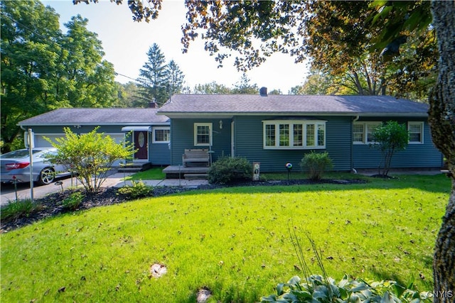 single story home with a garage and a front yard