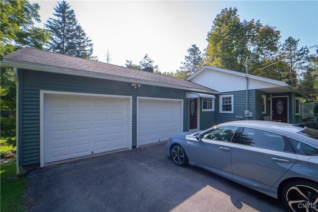 ranch-style house featuring a garage