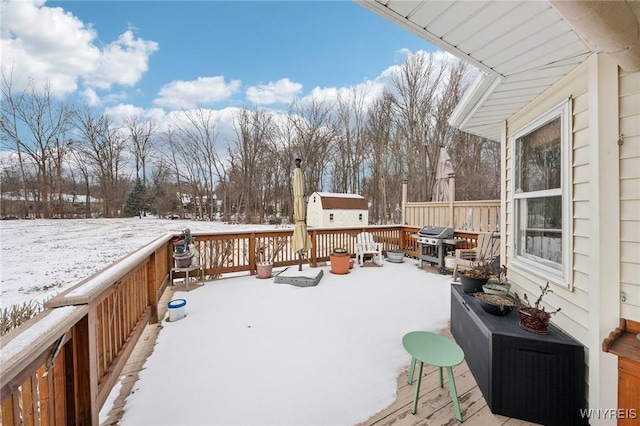 view of snow covered deck