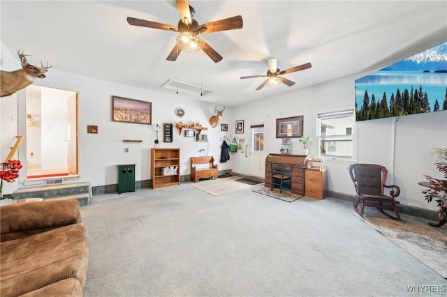 living room with carpet flooring, a textured ceiling, and ceiling fan