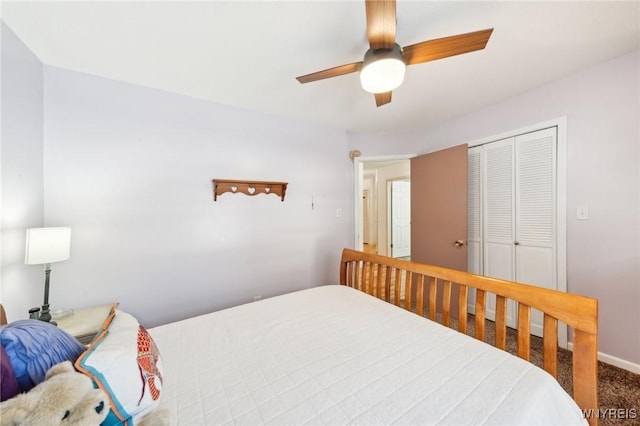 bedroom featuring ceiling fan, a closet, and carpet