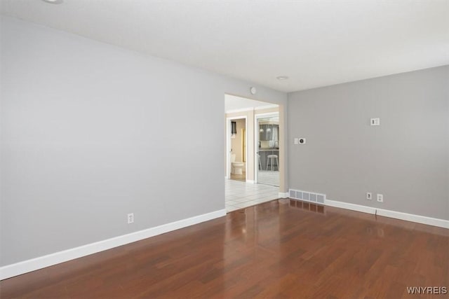 empty room featuring hardwood / wood-style flooring