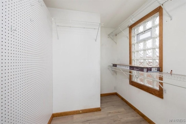 walk in closet featuring light wood-type flooring