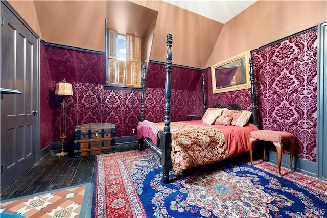 bedroom with hardwood / wood-style flooring and vaulted ceiling