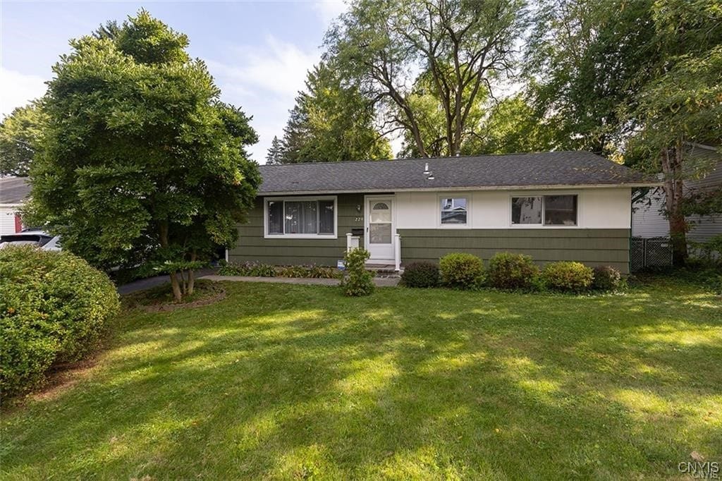 ranch-style house with a front lawn