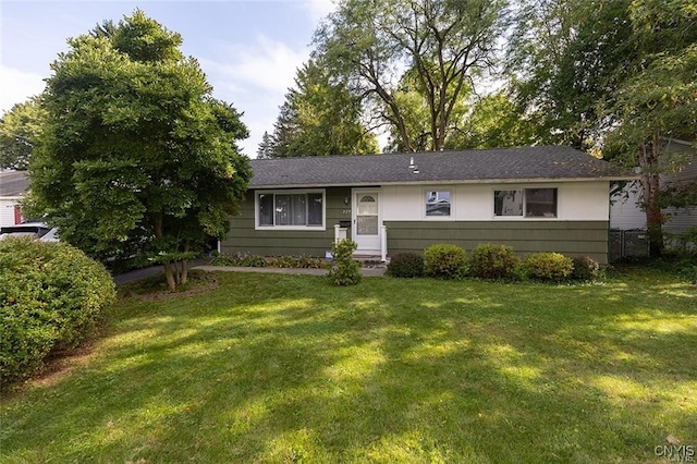 ranch-style house with a front lawn