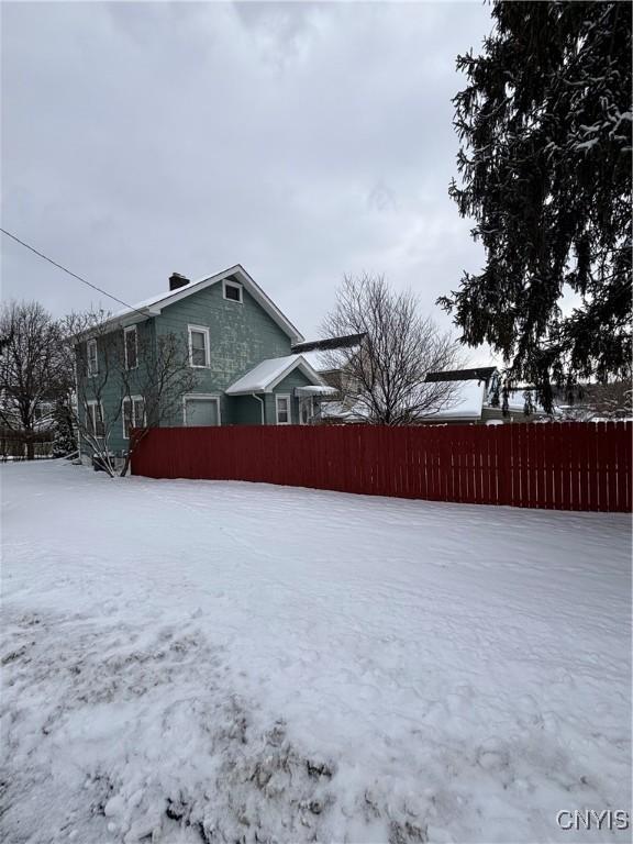 view of yard covered in snow