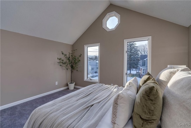 bedroom with vaulted ceiling and dark colored carpet