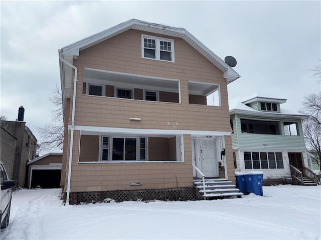 view of front of home featuring a garage and an outdoor structure