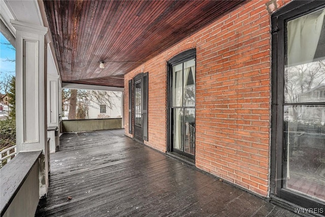 wooden terrace featuring a porch