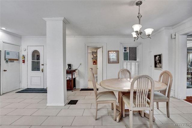 dining area with crown molding, light tile patterned floors, and a chandelier