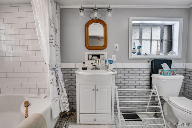 full bathroom featuring tile walls, toilet, and shower / tub combo