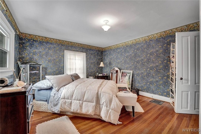 bedroom with wood-type flooring