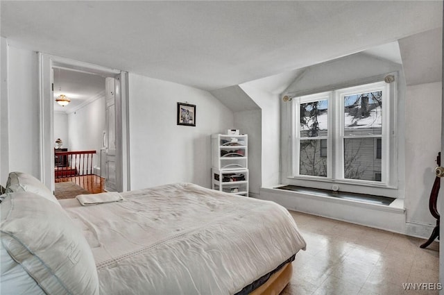 bedroom featuring vaulted ceiling