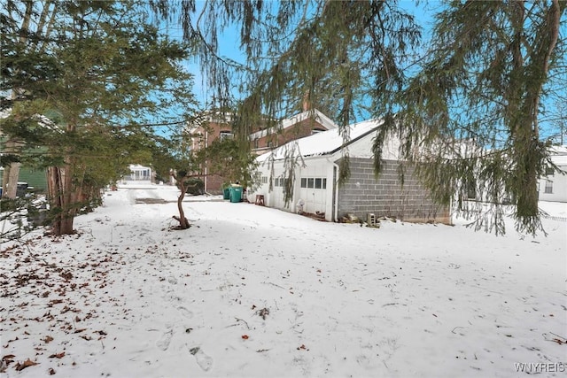 view of yard covered in snow