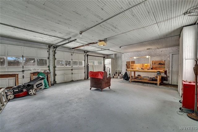 garage featuring a garage door opener and a workshop area