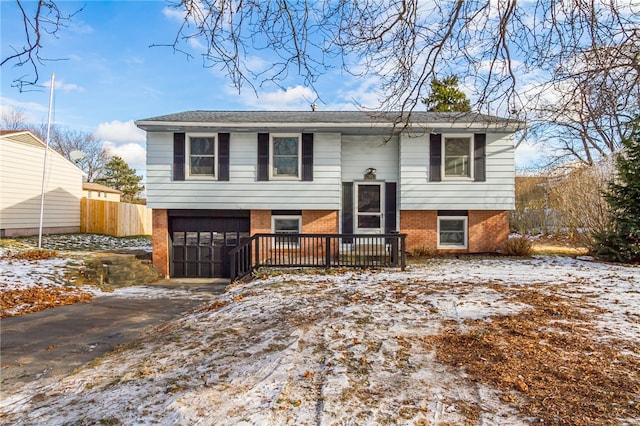 bi-level home featuring a garage