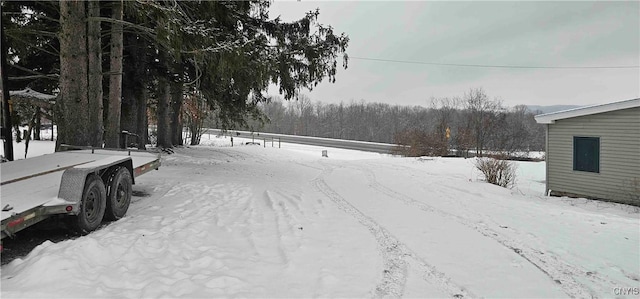 view of yard covered in snow