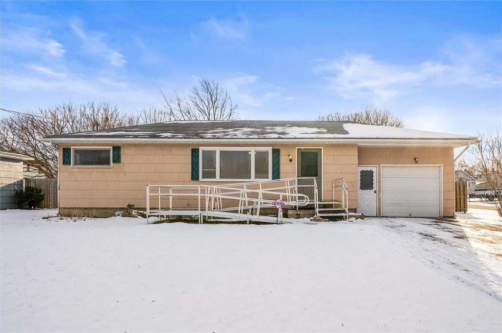 single story home featuring a garage