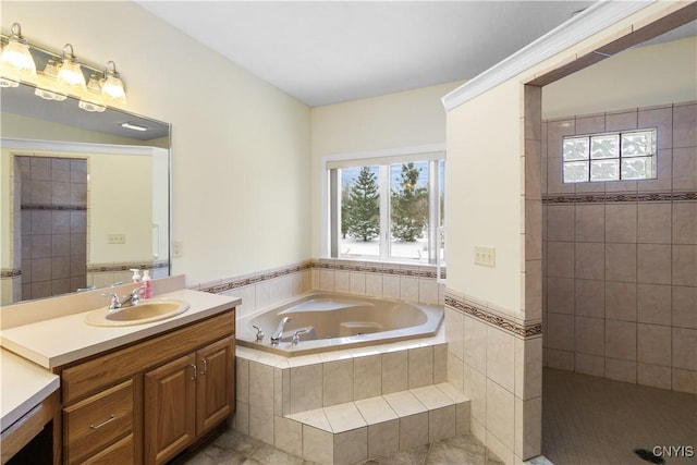 bathroom featuring independent shower and bath, tile patterned flooring, and vanity