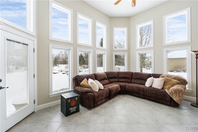 sunroom / solarium featuring ceiling fan and a healthy amount of sunlight