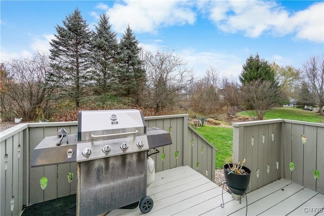 wooden deck featuring area for grilling