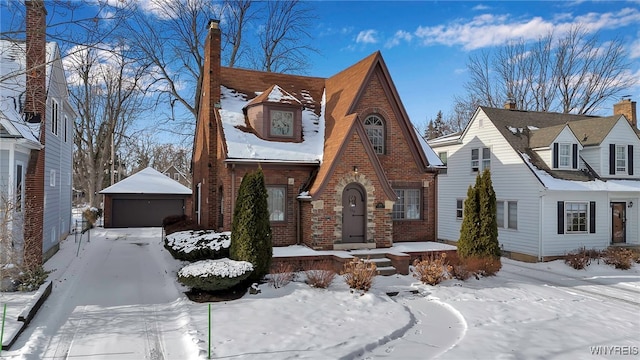 view of front of home featuring a garage and an outdoor structure