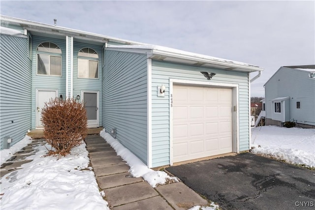 view of snow covered garage