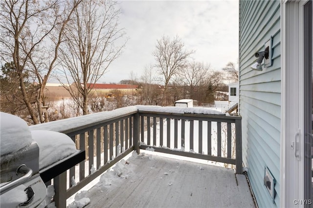 snow covered deck with area for grilling