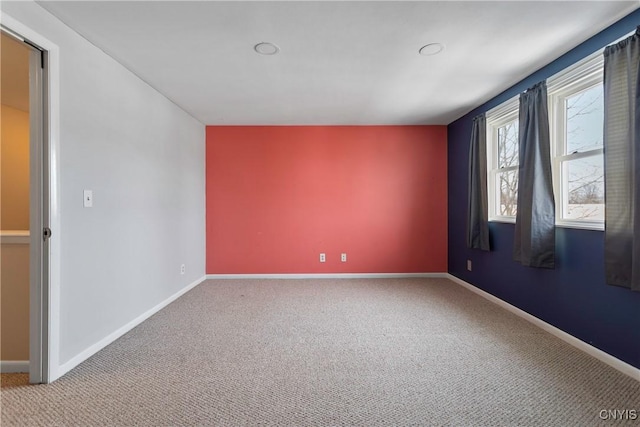 empty room with light colored carpet