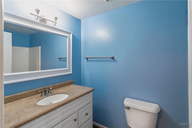 bathroom with toilet and vanity