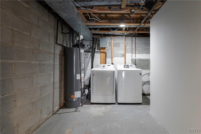 basement with washing machine and dryer and water heater