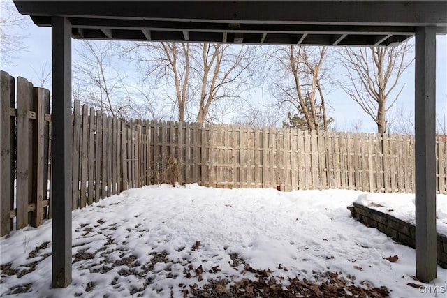 view of yard layered in snow