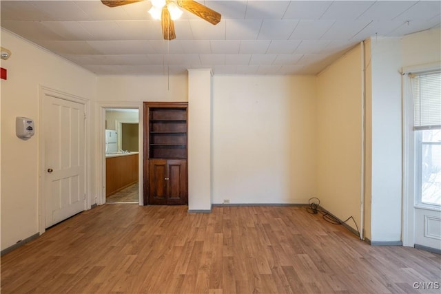 spare room with ceiling fan and light hardwood / wood-style flooring